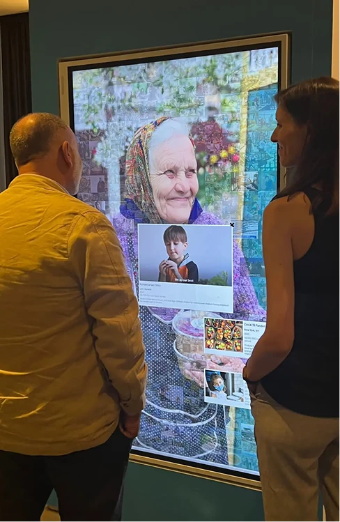 Guests viewing the digital mosaic portrait