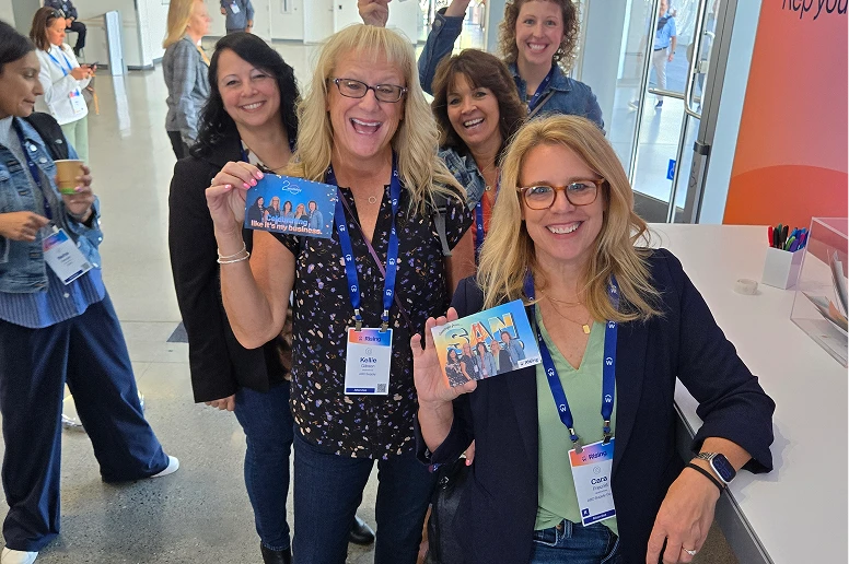 Group holding their personalized postcards
