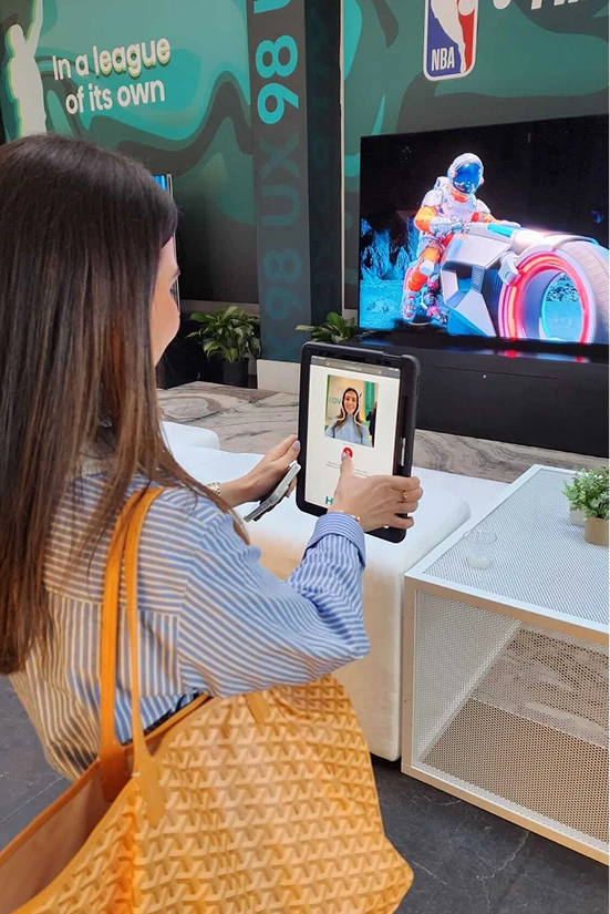 Guest using a tablet photo booth at an NBA event