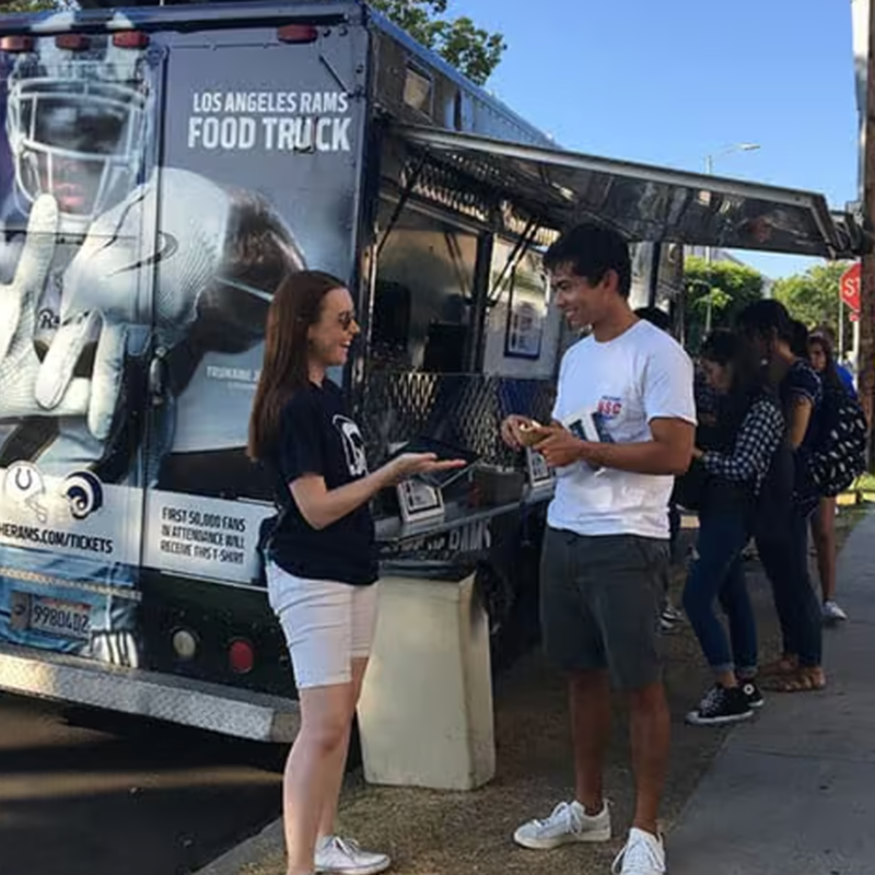 Guests at a food truck activation with the tablet booth